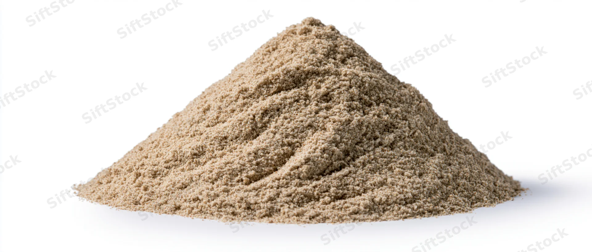 A pile of dry desert sand with natural ridges and peaks on a white background