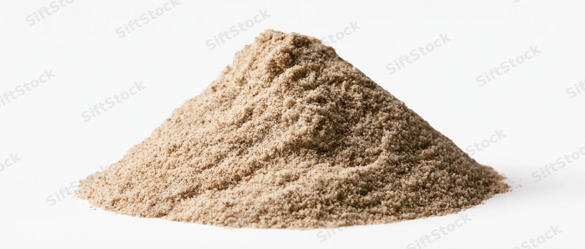 A small pile of dry desert sand with natural ridges and peaks on a white background