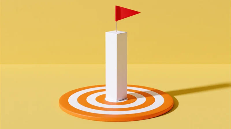 White pillar with red flag at center of orange and white target on yellow background