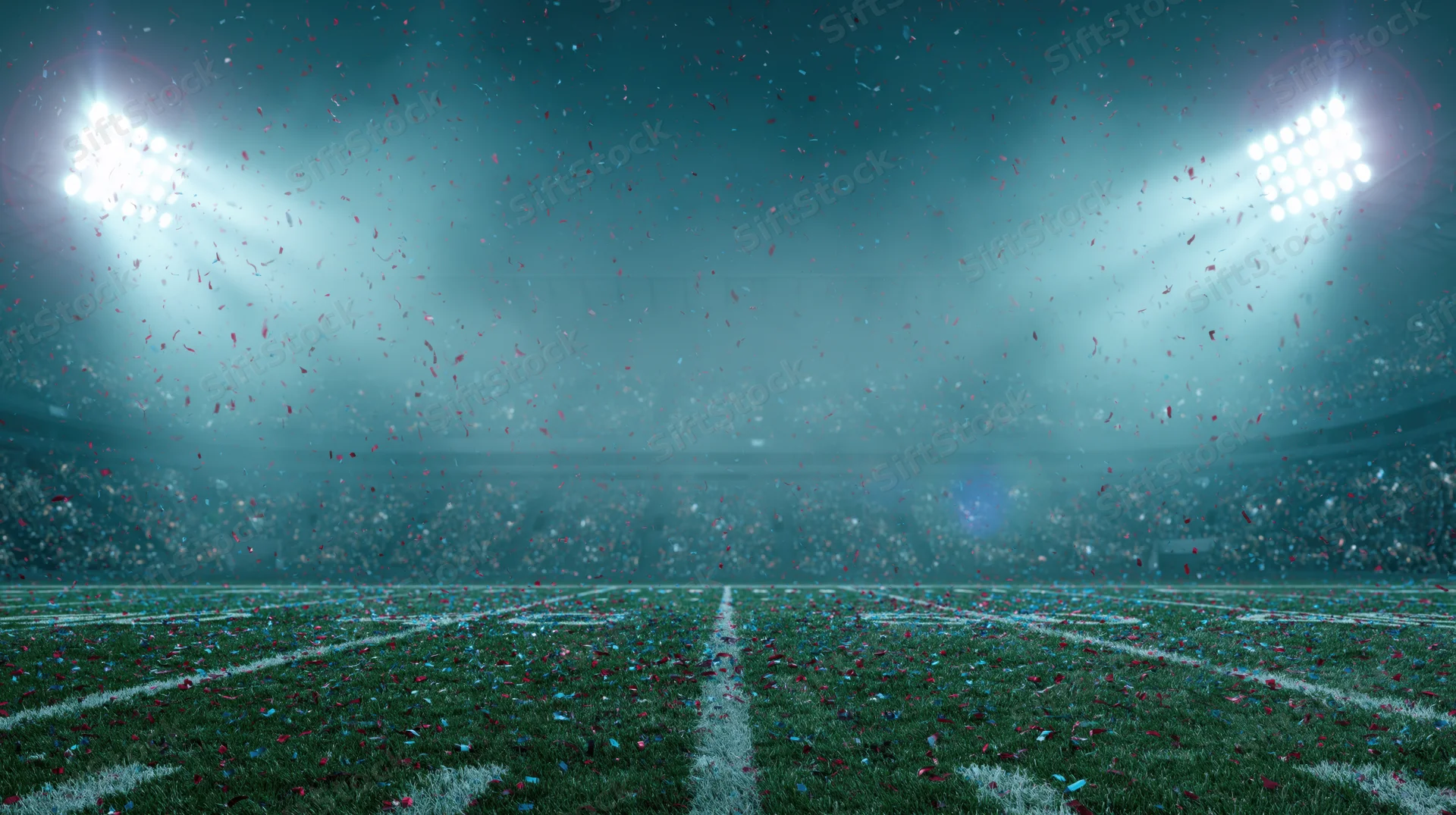 Football field at night under bright stadium lights with falling confetti and empty stands
