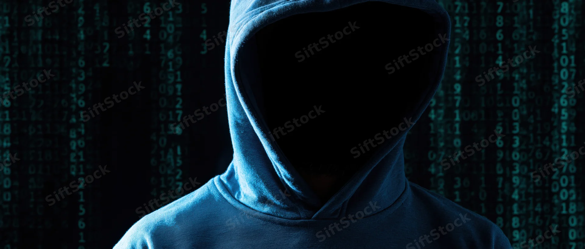 Hooded figure in silhouette against digital code background