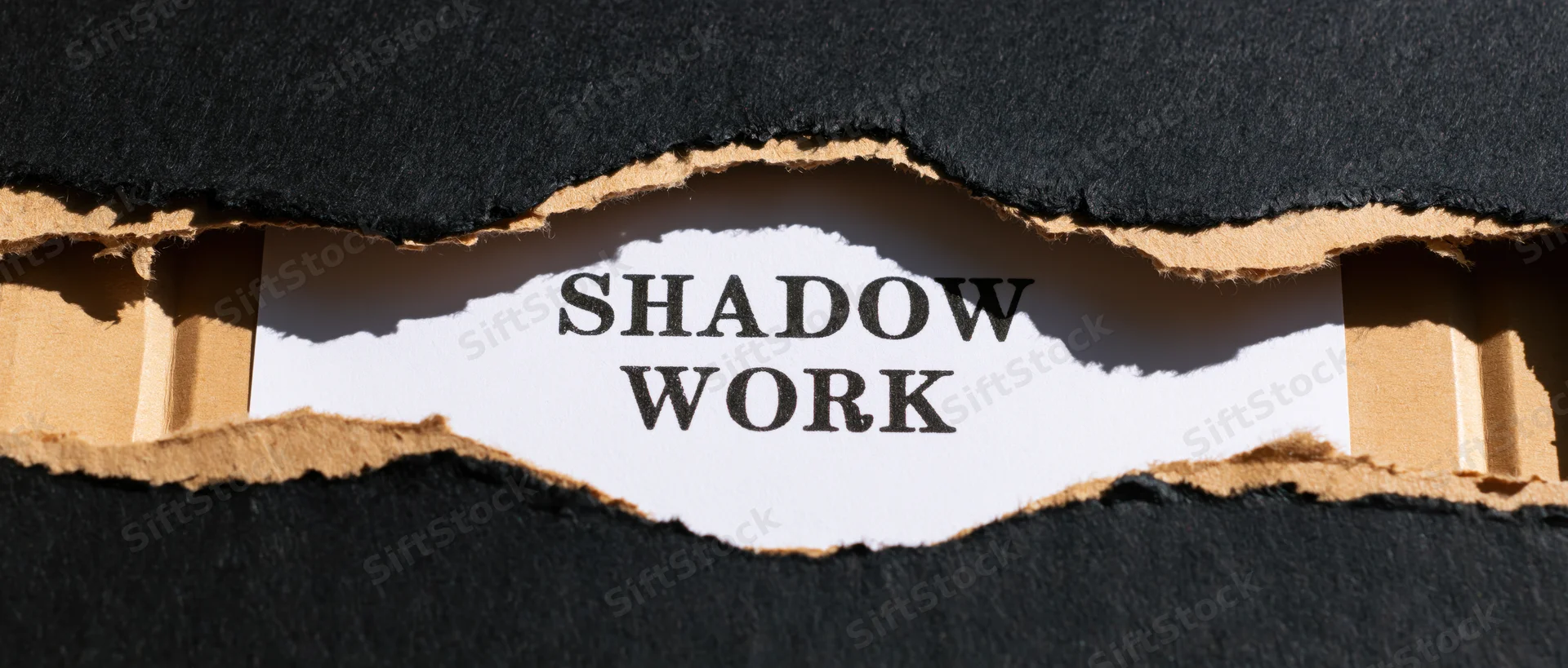 Torn black cardboard revealing the text shadow work on white paper beneath