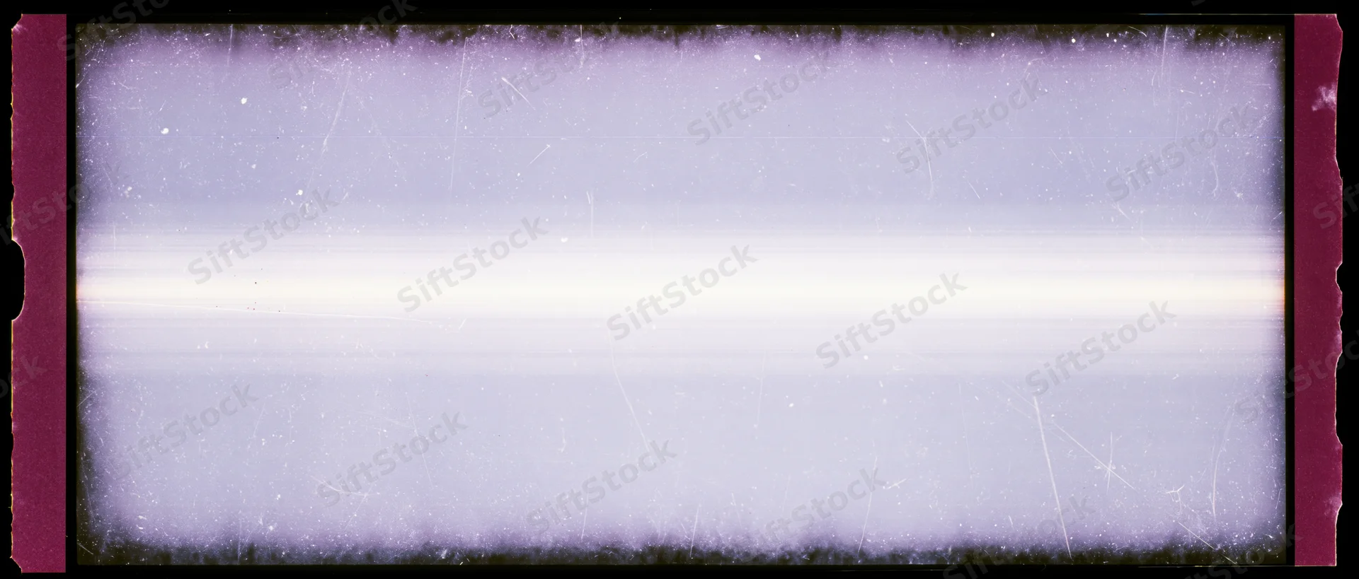 Overexposed 35mm film frame with light leak and scratches showing magenta borders and white center