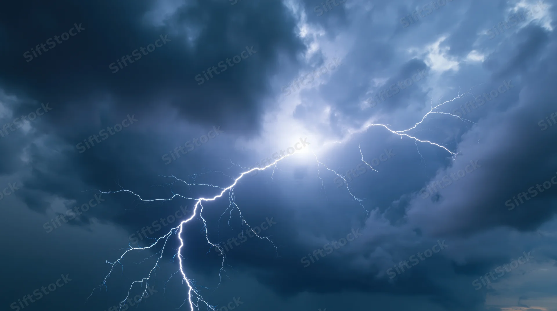 Bright lightning bolt splitting across a dark stormy sky