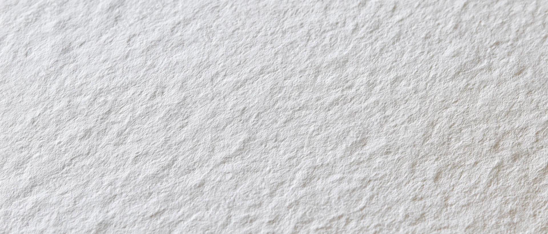 Close-up of a blank sheet of cold-press watercolor paper with textured surface