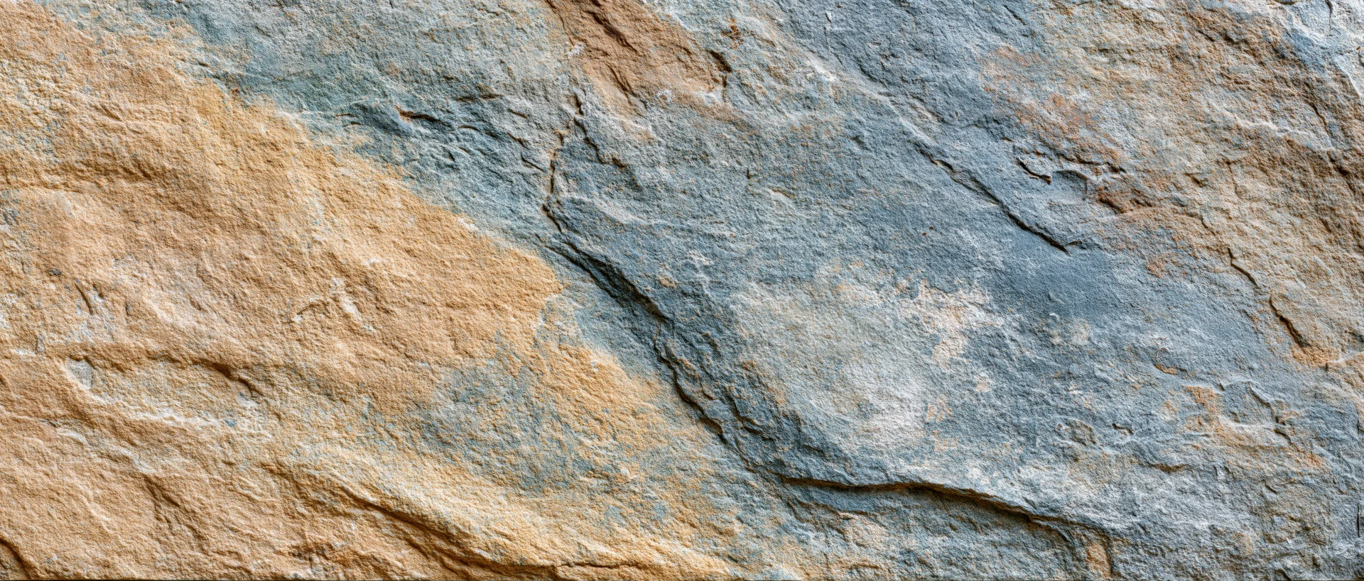 Close-up of natural stone surface with visible layers and cracks