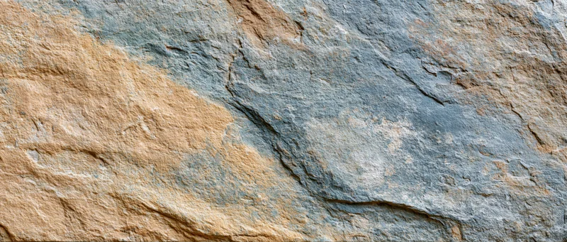 Close-up of natural stone surface with visible layers and cracks
