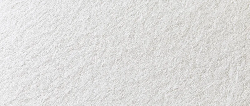 Close-up of white textured paper surface in flat lay arrangement