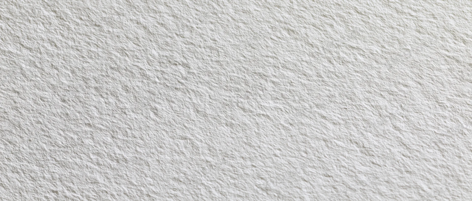 Close-up of plain white textured paper surface in flat lay arrangement