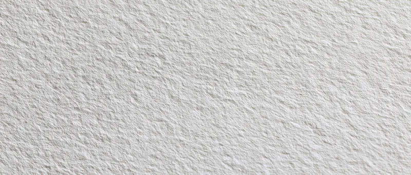 Close-up of plain white textured paper surface in flat lay arrangement