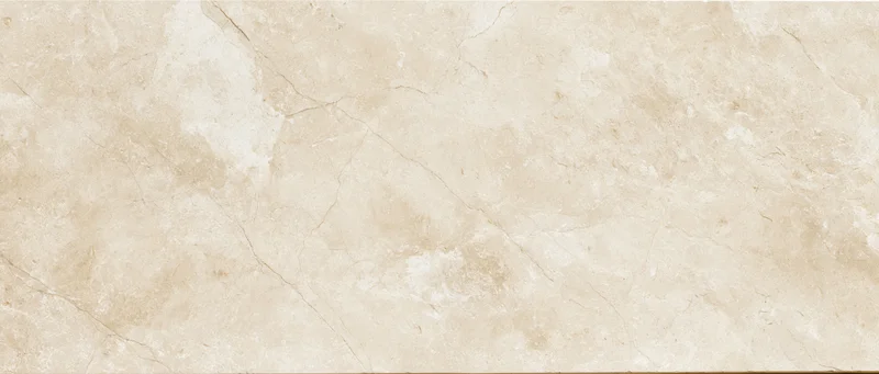 Close-up of a polished cream marble slab surface with natural veining and texture