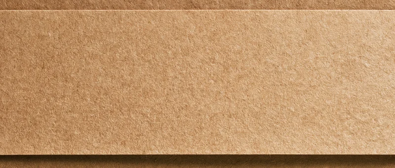 Close-up flat lay of a sheet of kraft paper filling the entire frame