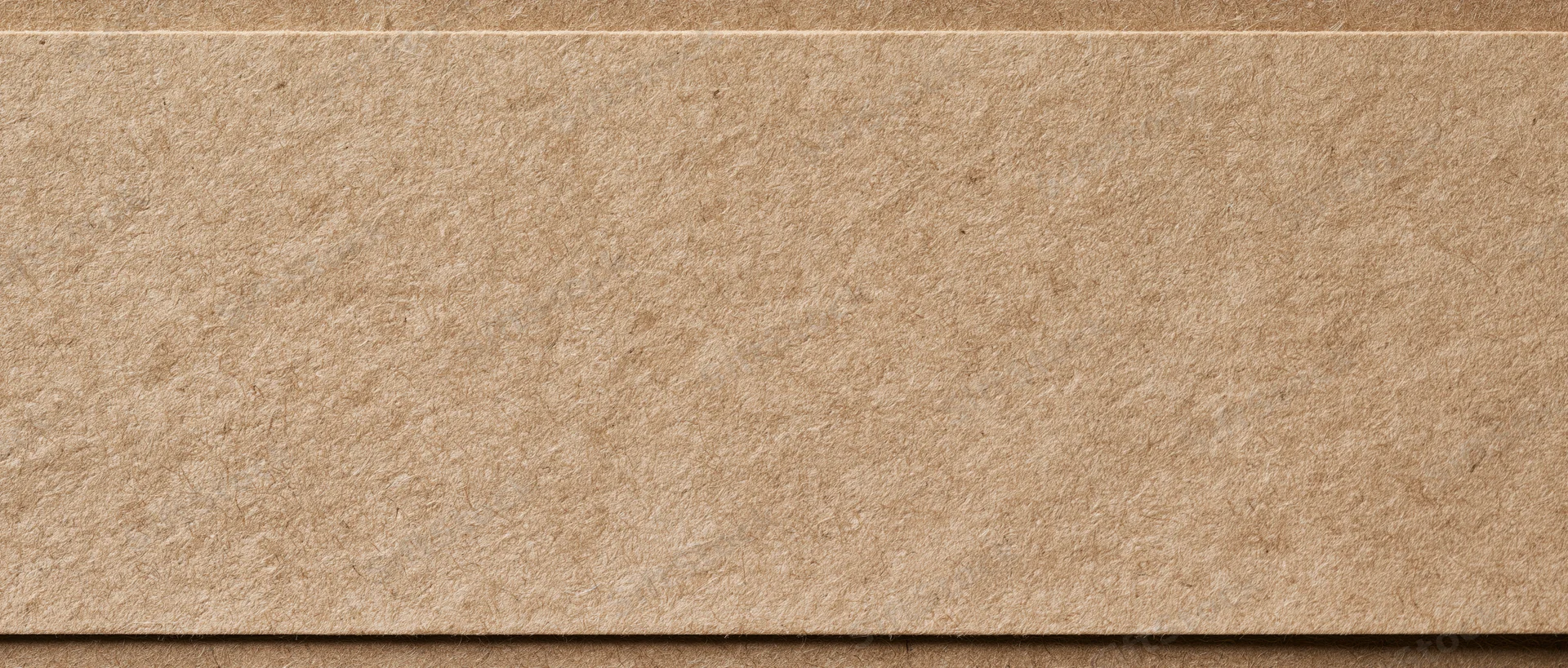 Close-up flat lay of a sheet of kraft paper filling the entire frame
