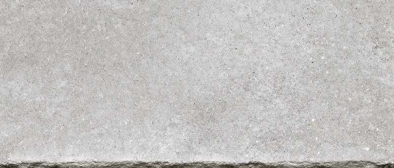 Close-up of a smooth concrete surface with visible texture and fine aggregate details