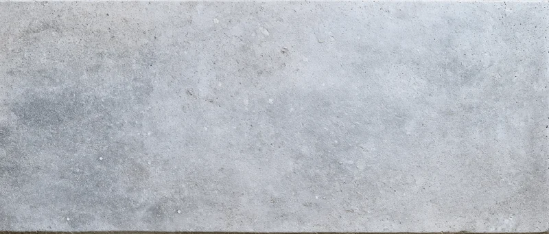 Close-up flat lay of a smooth gray concrete surface