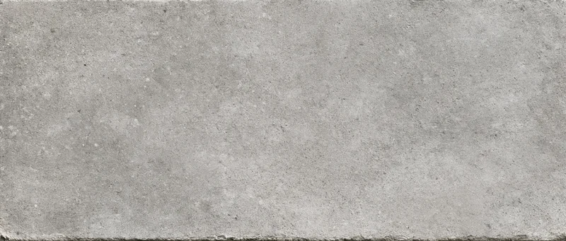 Close-up flat lay of a smooth concrete surface filling the frame