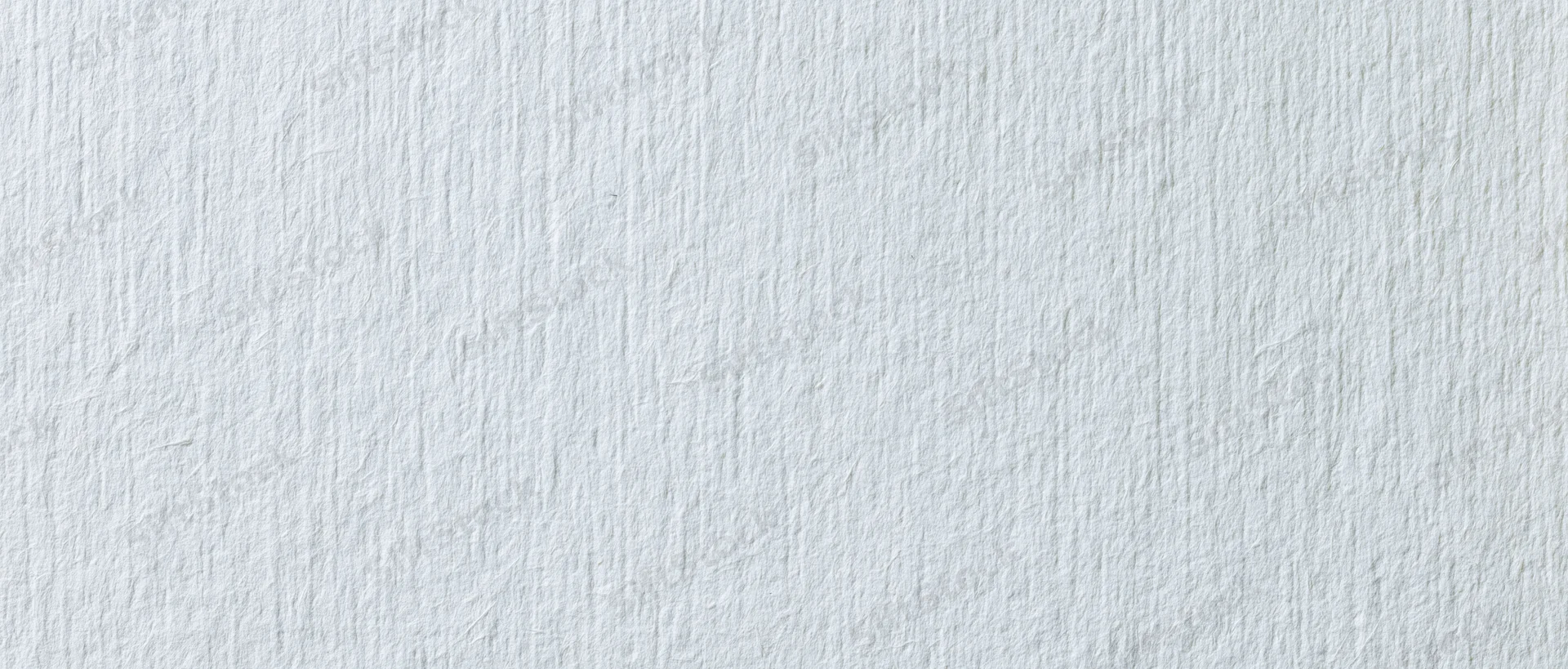 Close-up of white textured paper surface for design or craft use