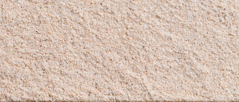 Closeup of dry beach sand texture filling the frame