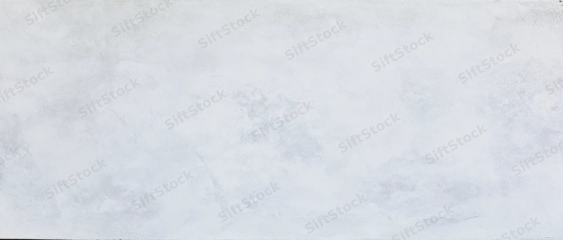 Close-up of smooth plastered concrete wall surface with subtle texture and gray-white tone