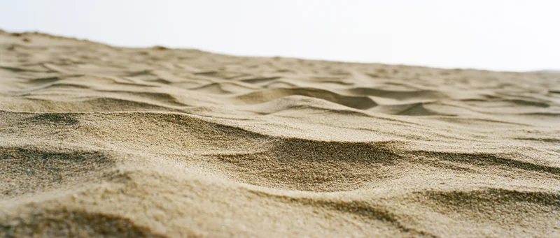 Close-up of rippled dry beach sand at ground level