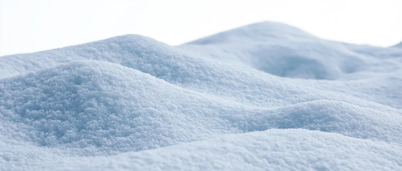 Close-up of fresh snow drifts on the ground in a winter landscape