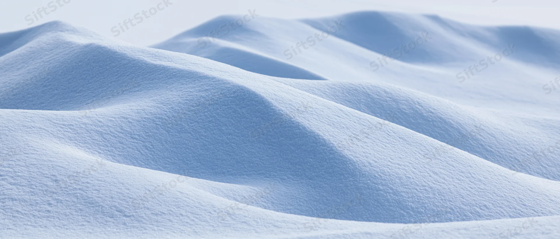 Soft undulating snow drifts in a winter landscape