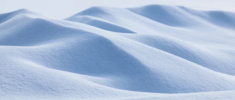 Soft undulating snow drifts in a winter landscape