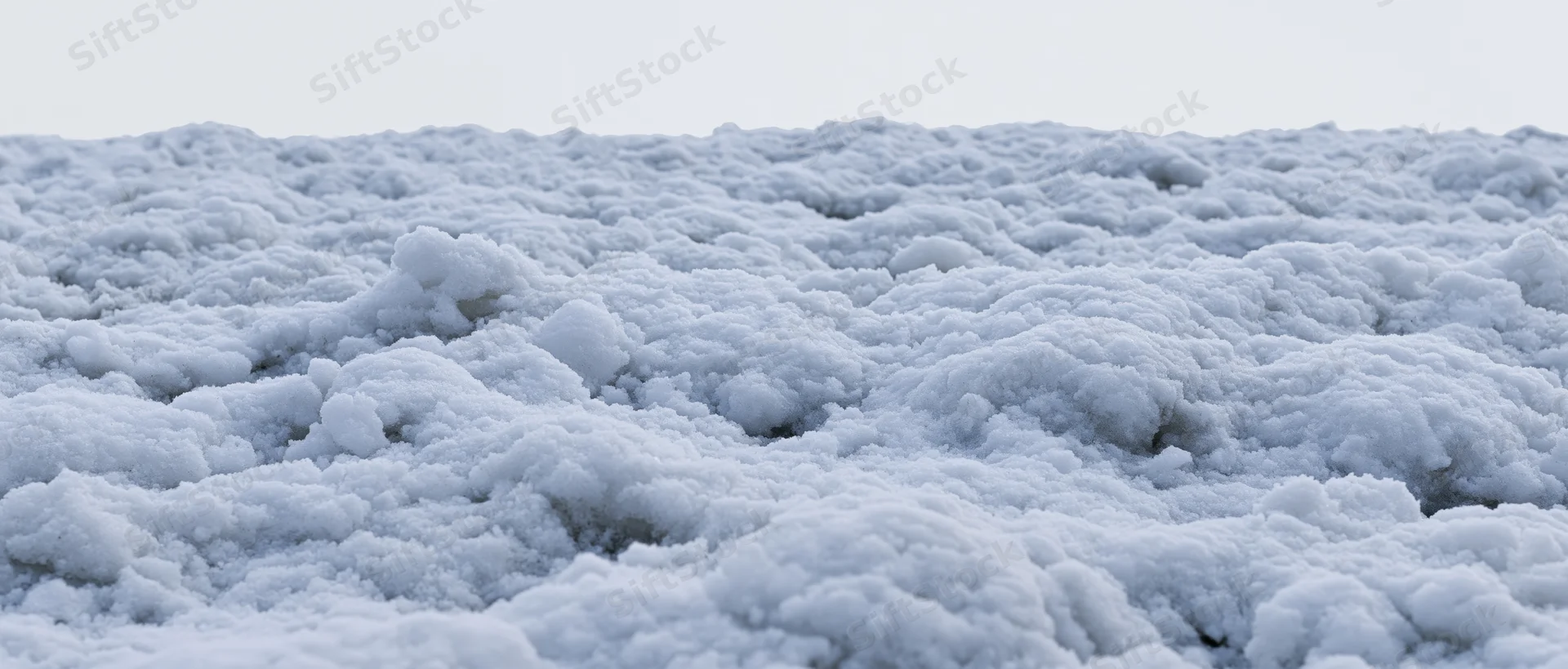 Closeup of freshly disturbed snow surface at ground level