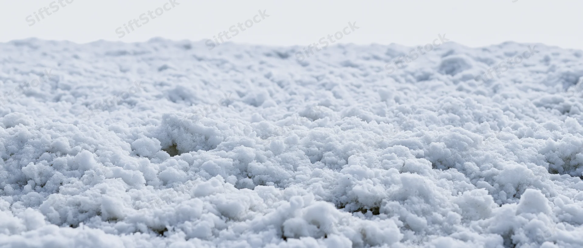 Close-up ground-level view of freshly disturbed snow surface