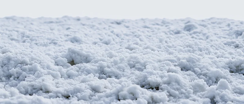 Close-up ground-level view of freshly disturbed snow surface