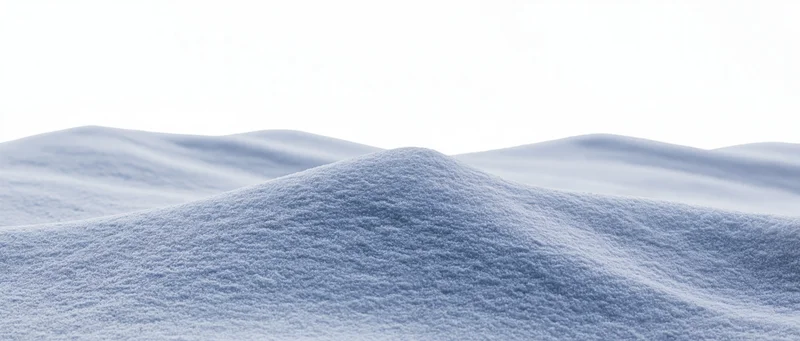 Undulating snow drifts at ground level in a winter landscape