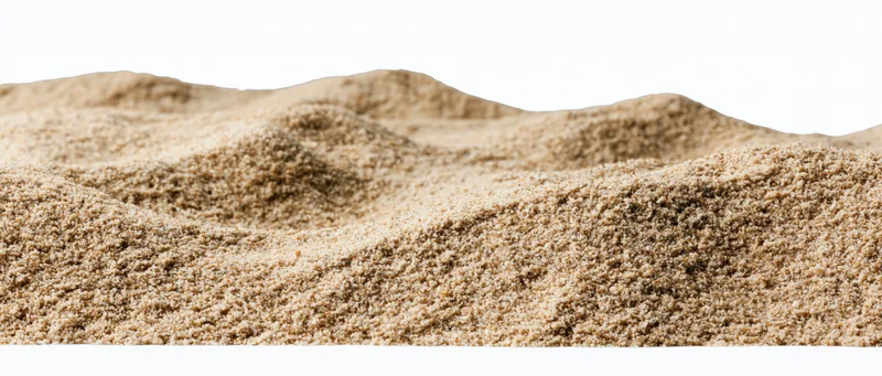 Close-up of small dry sand mounds with gently rolling surface on white background