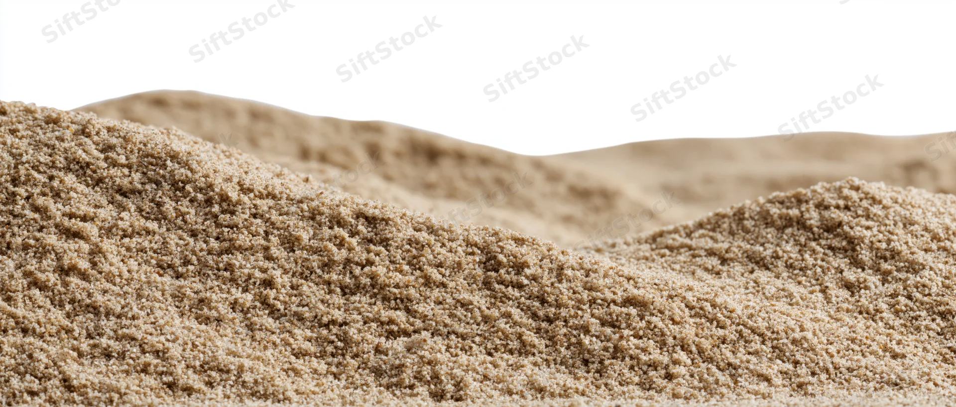 Close-up of small dry sand mounds with gently rolling surface against white background