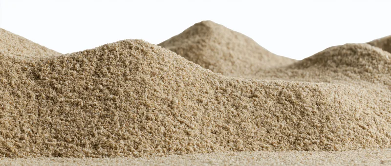 Closeup of dry sand mounds with gently rolling surface against white background