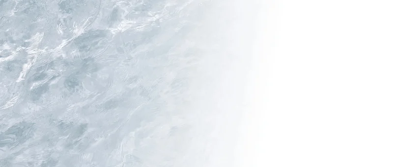Closeup overhead view of clear shallow water surface with ripples and light reflections