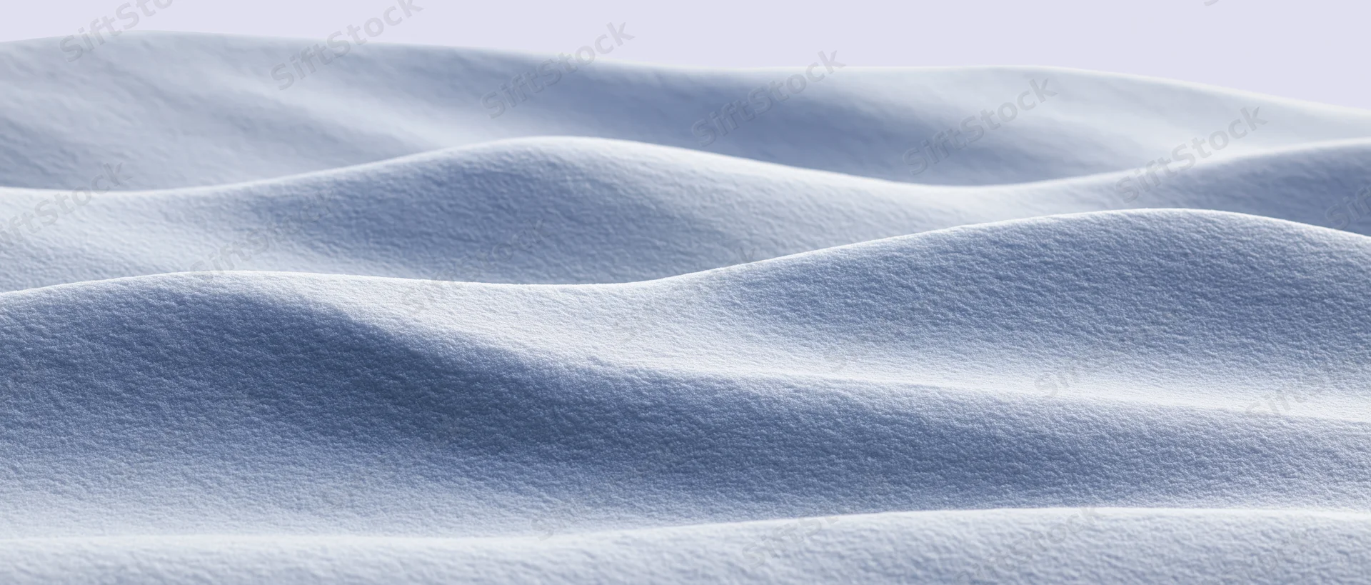 Smooth undulating snow surface in a wide panoramic winter landscape