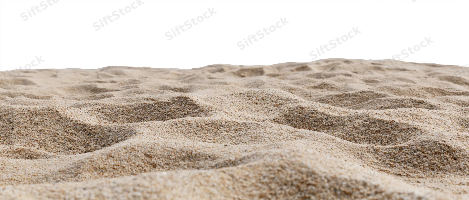 Close-up of dry beach sand surface with ripples and texture isolated on white