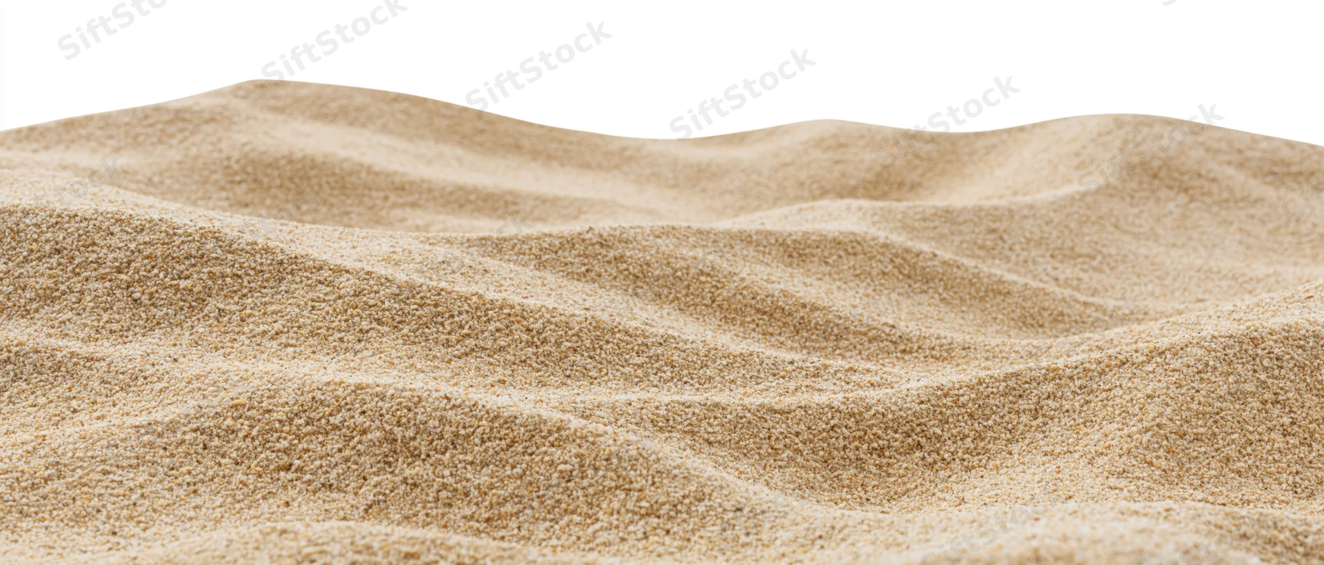 Close-up of rippled dry beach sand with small dunes on white background