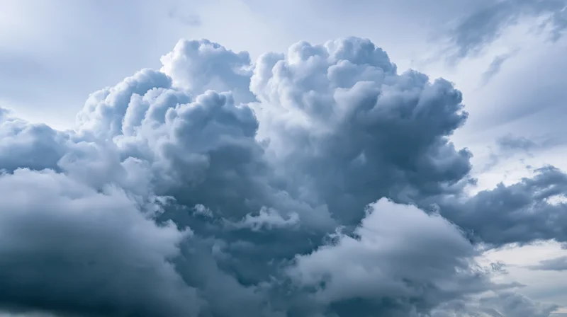 Dramatic cumulonimbus clouds billowing across the sky in a stormy atmosphere