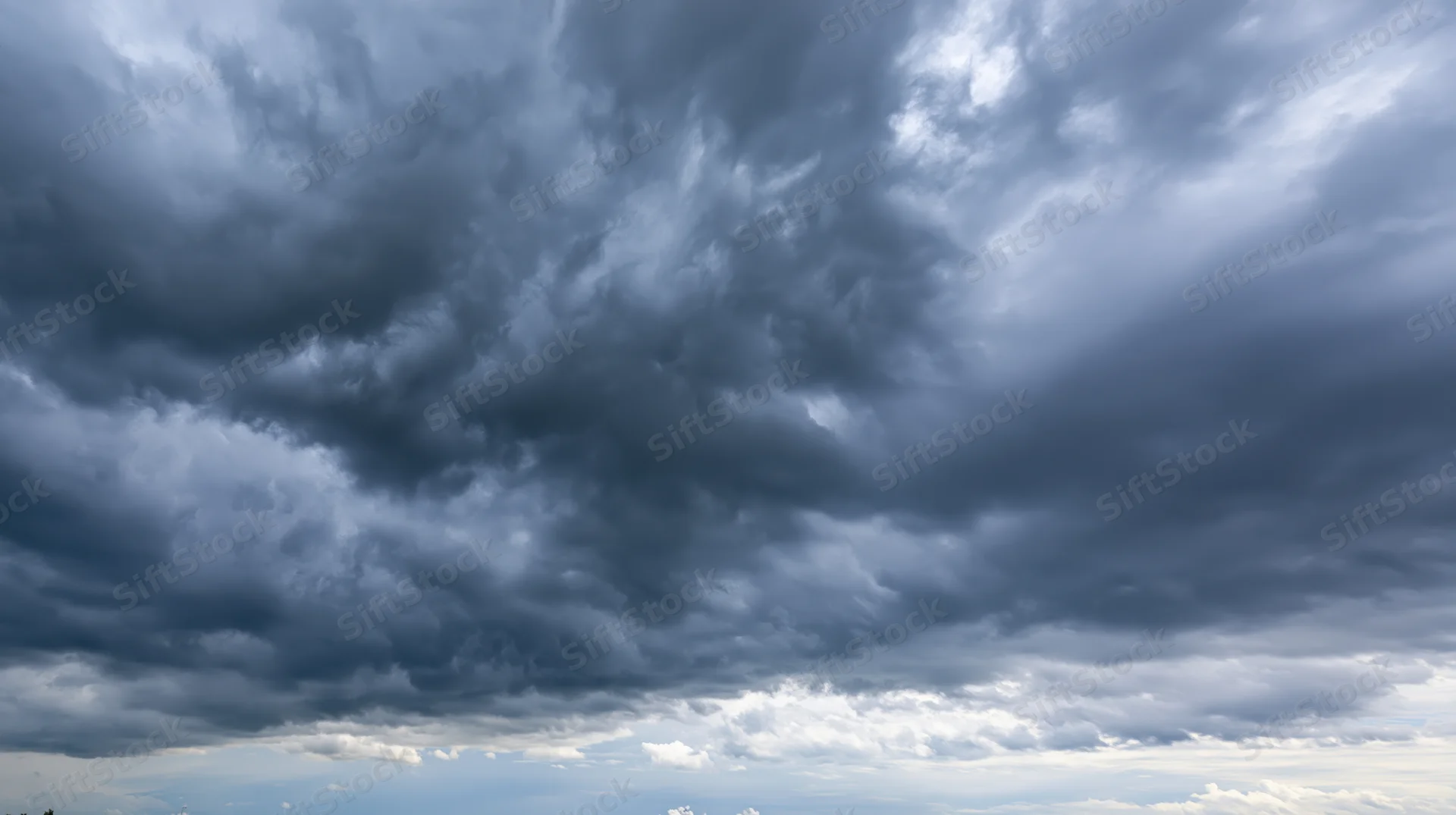 Dark cumulonimbus clouds filling the sky before a storm