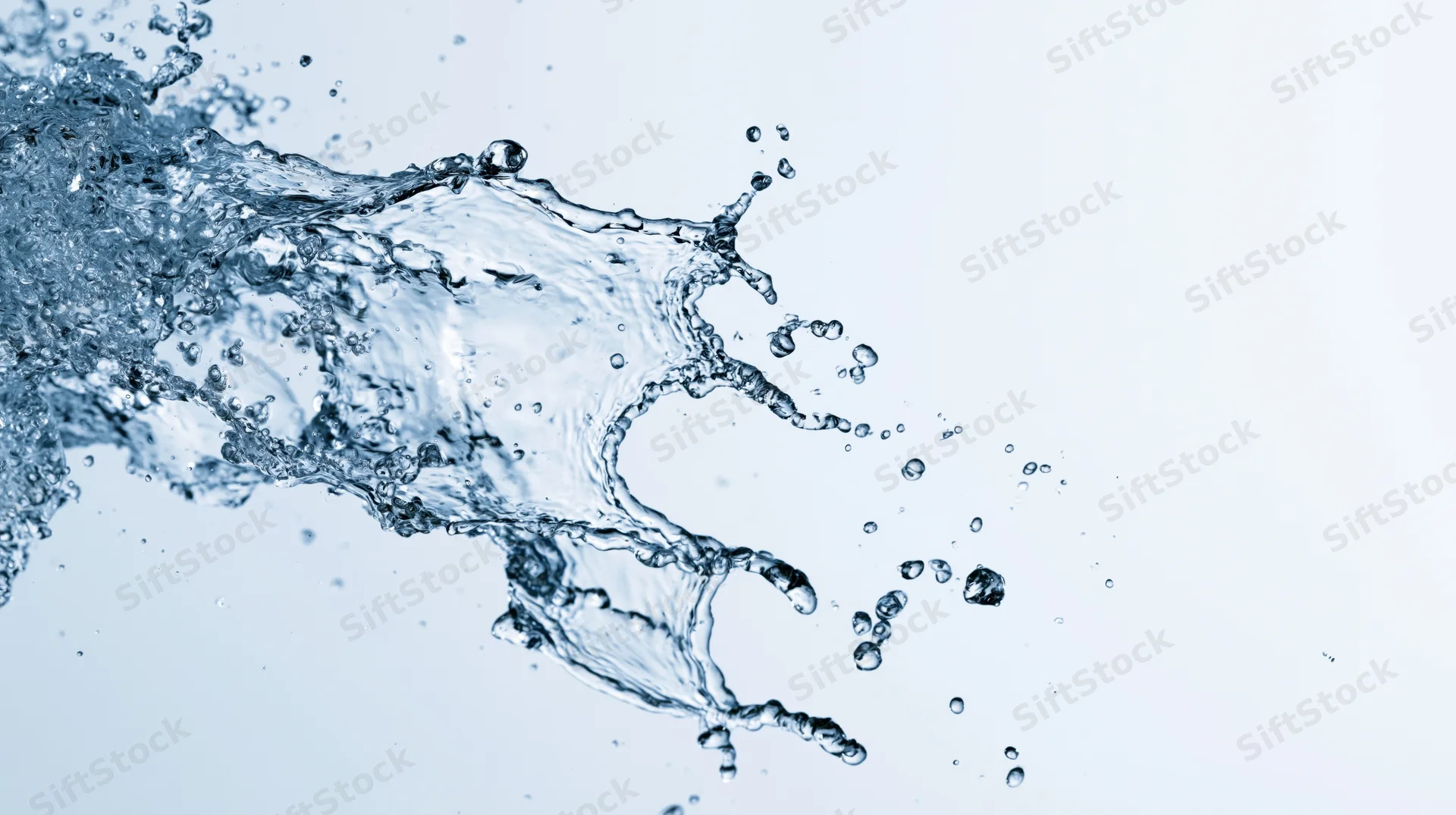Dynamic water splash frozen mid-motion against a clean white background