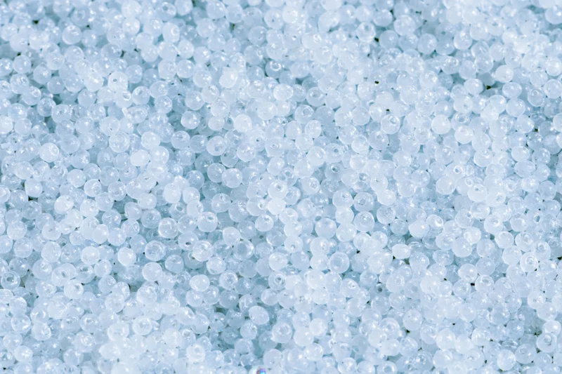 Closeup of translucent white plastic beads covering the frame as a textured surface