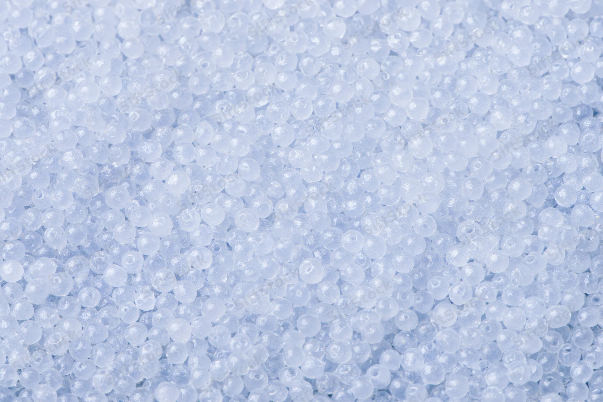 Close-up of translucent white plastic beads filling the frame