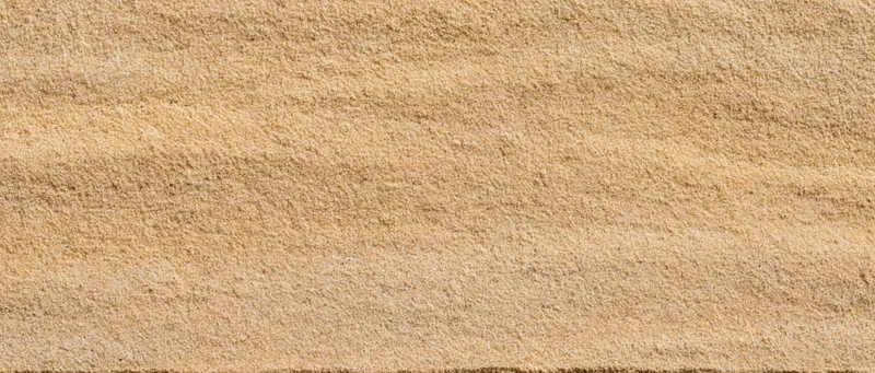Closeup of fine dry beach sand surface filling the frame