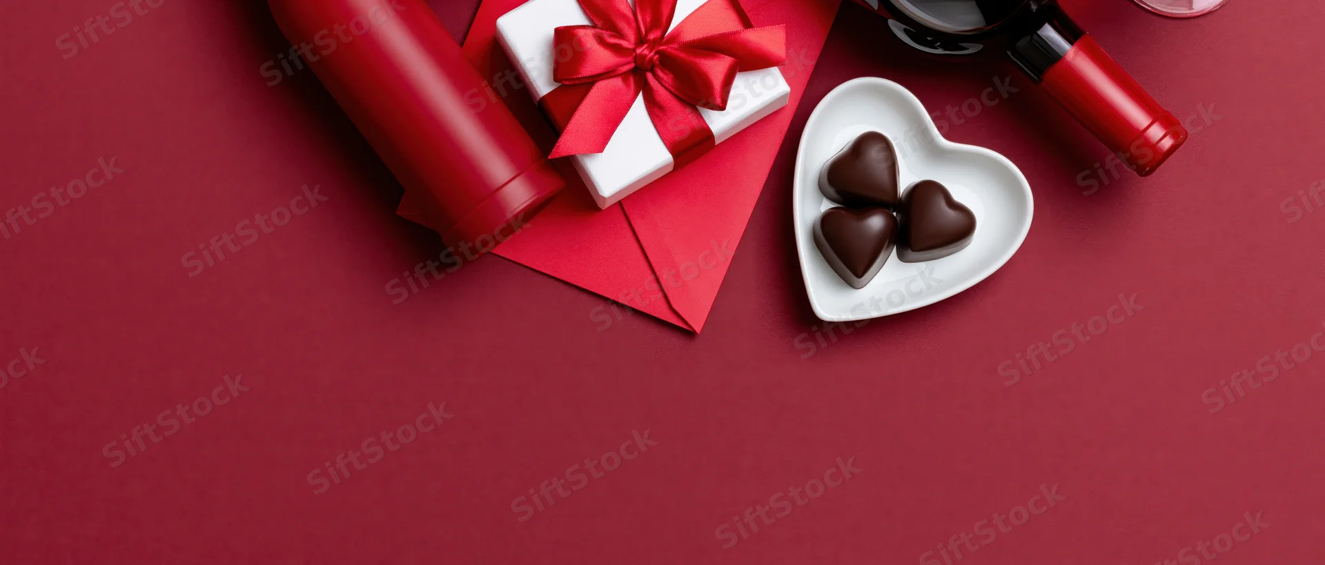 Valentines day items arranged in upper right corner on red surface