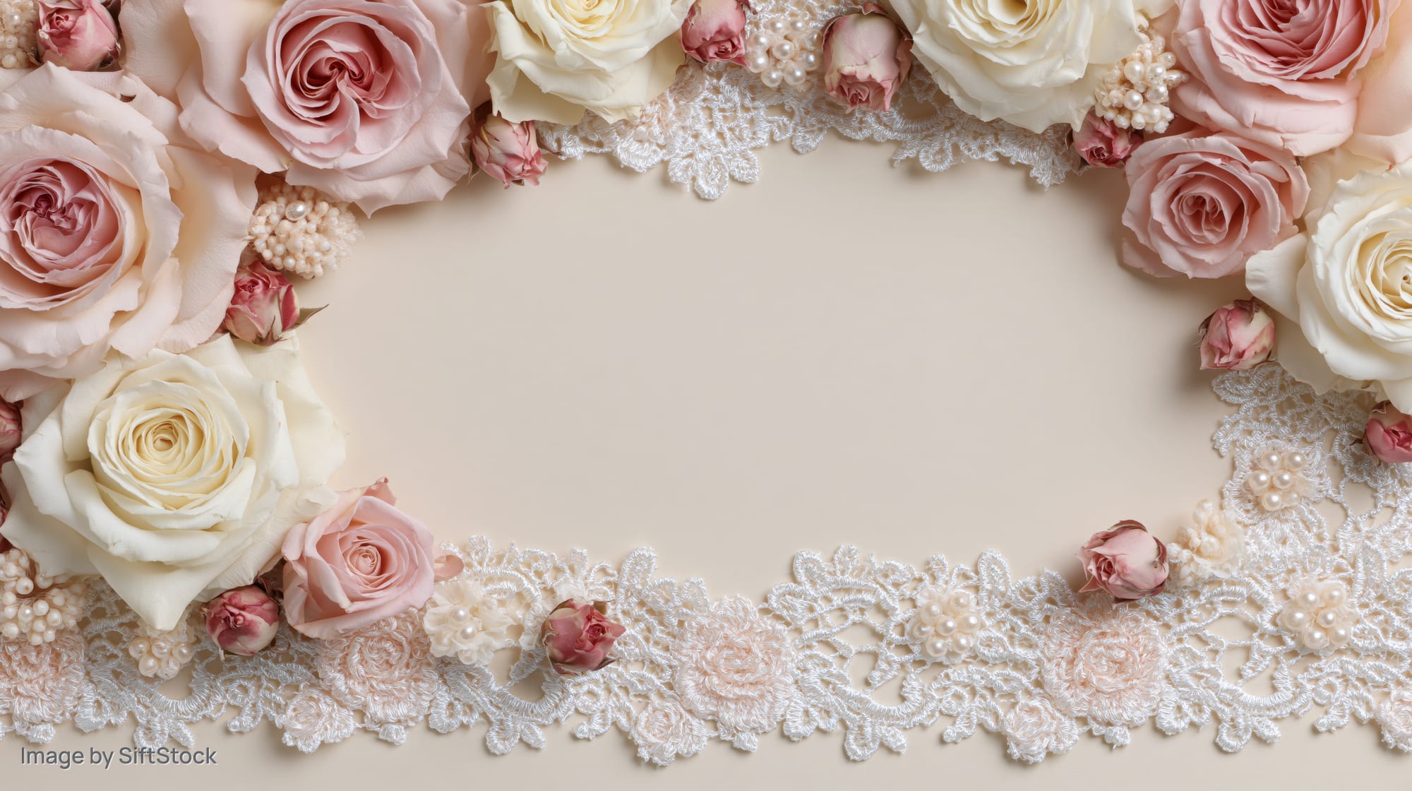 Blush pink and cream roses with white lace trim arranged in a circular frame on a neutral background with copyspace