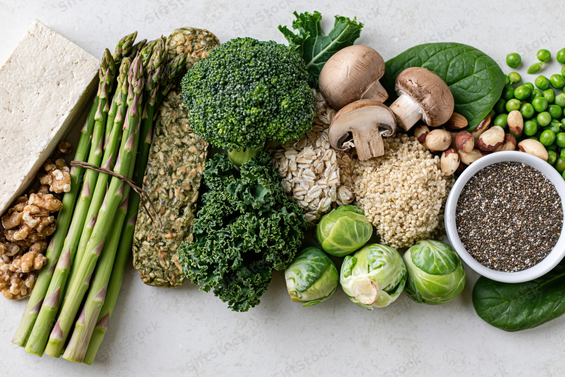 Plant-based protein foods arranged in a flat lay on a light surface
