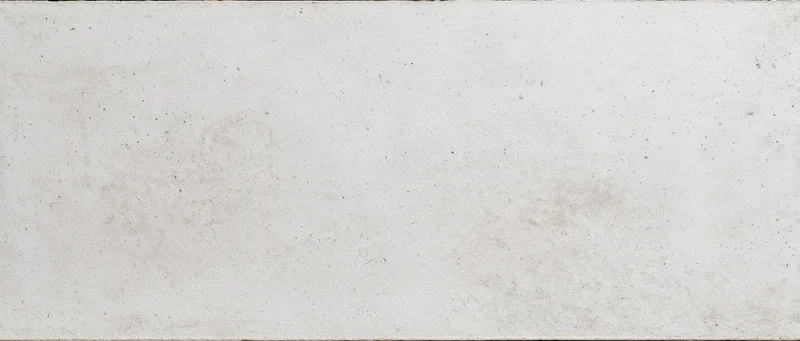 Close-up of a smooth gray concrete wall with subtle texture and minor imperfections