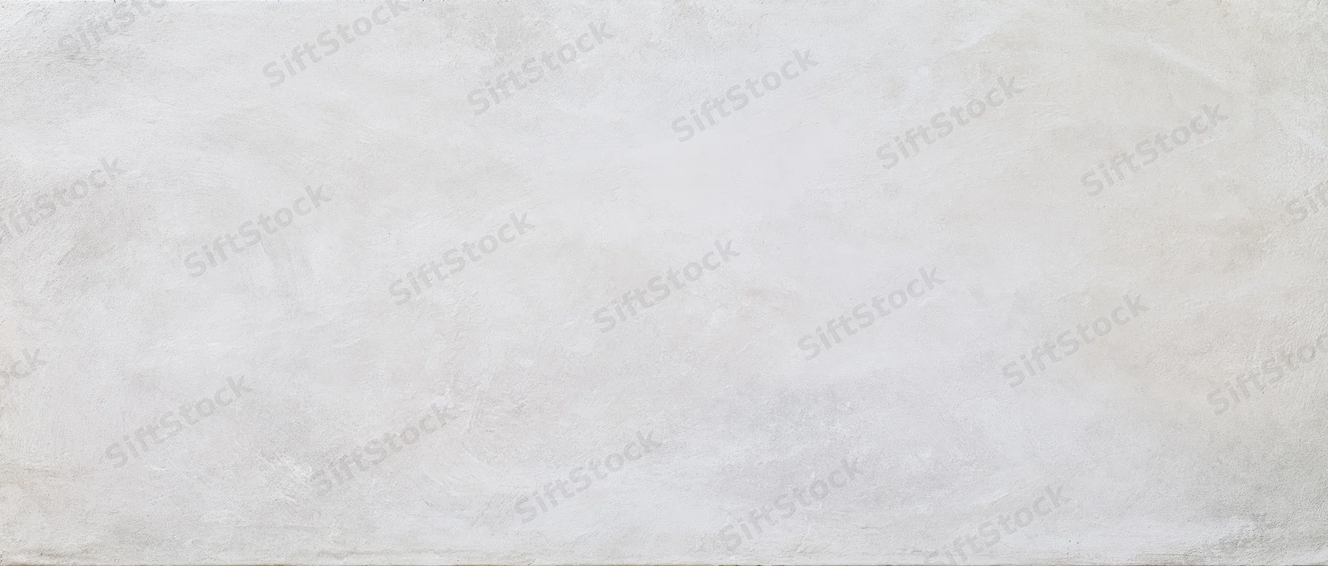 Smooth concrete wall surface with subtle texture and neutral tone