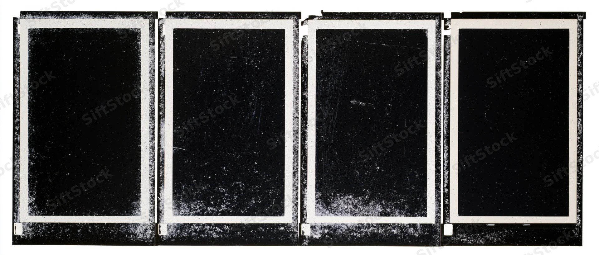 Four black film negative frames arranged side by side in a horizontal strip